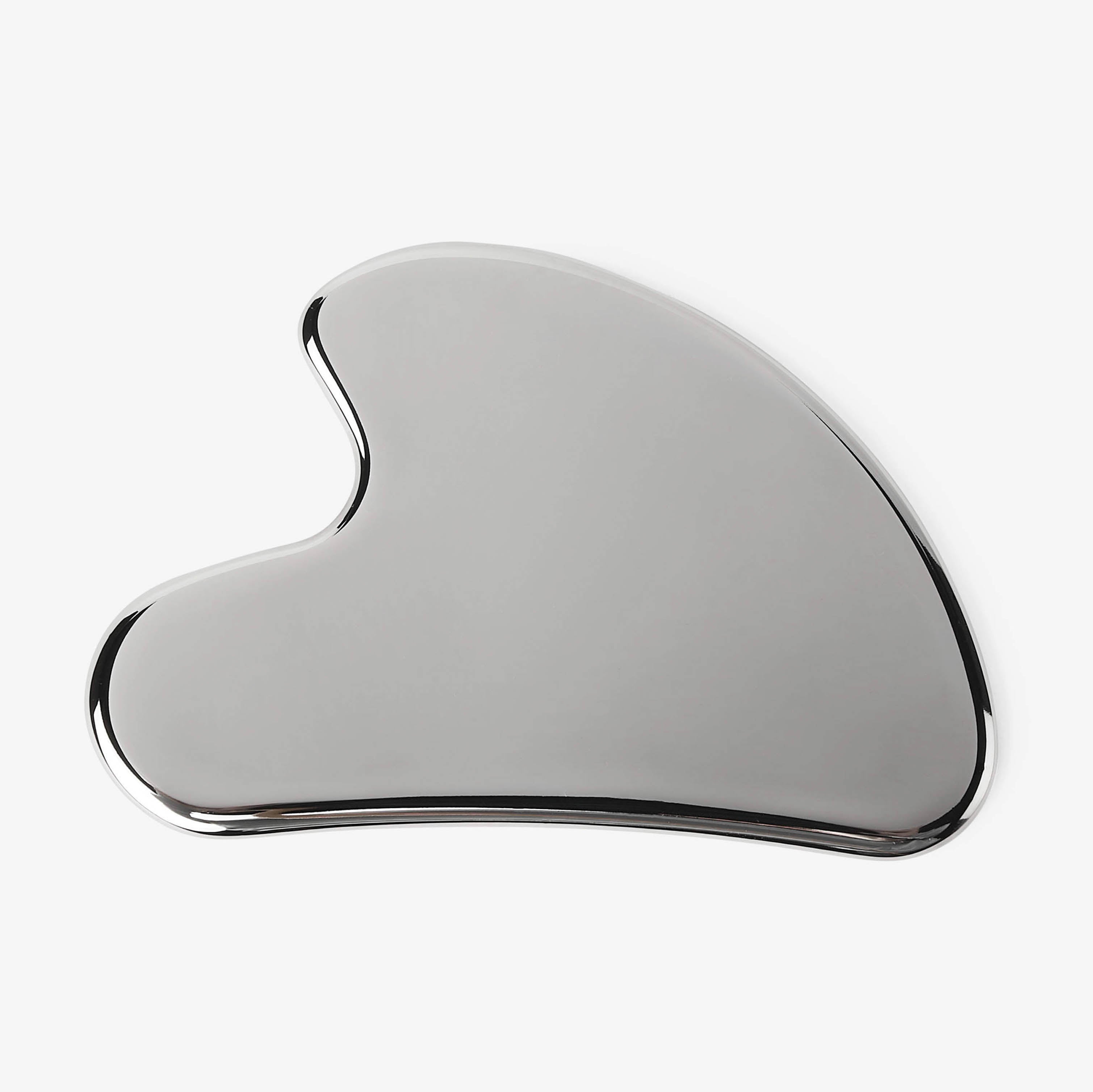 Silver Gua Sha tool on a white background