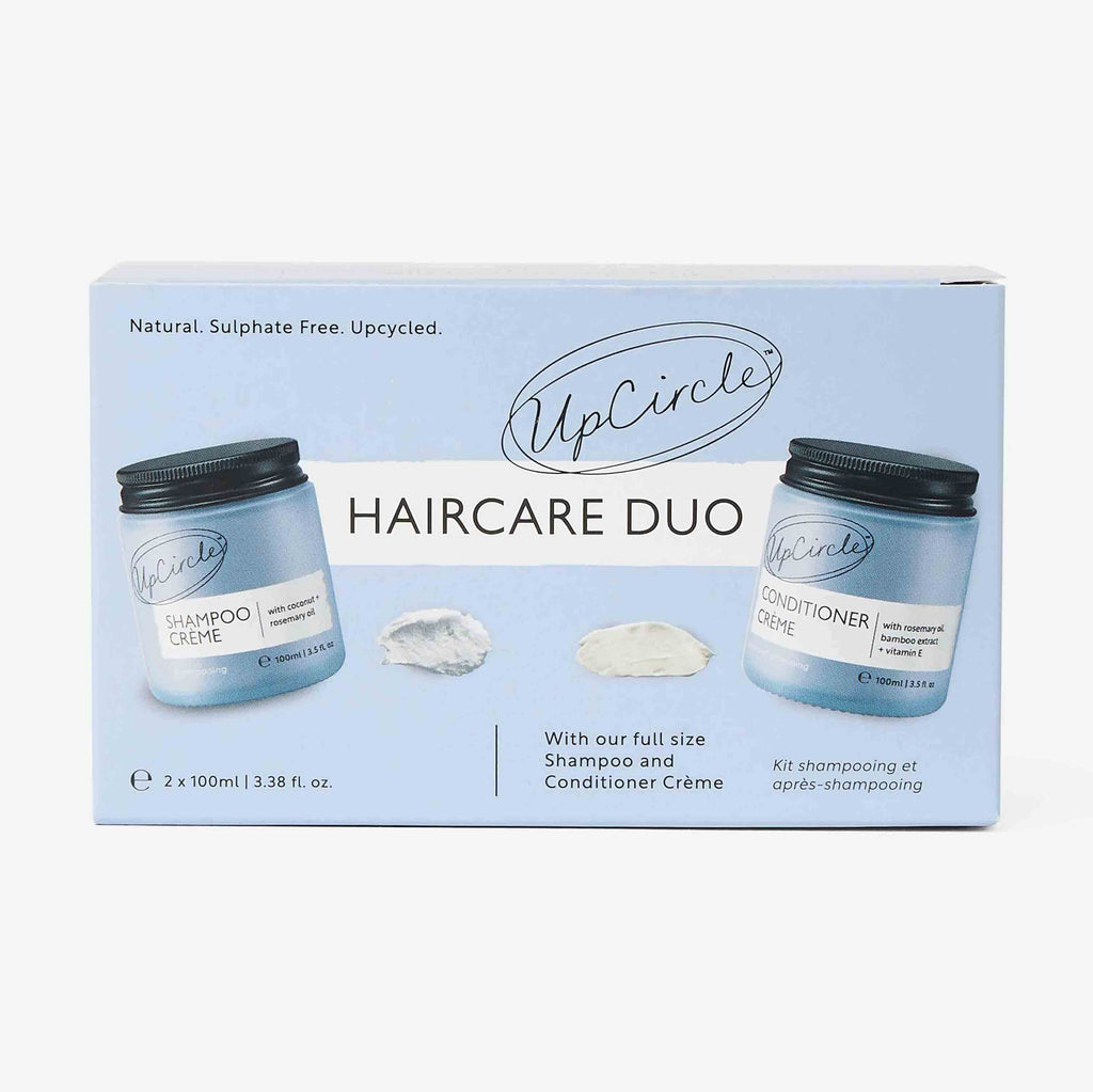 UpCircle haircare duo packaging with two jars on a light blue background