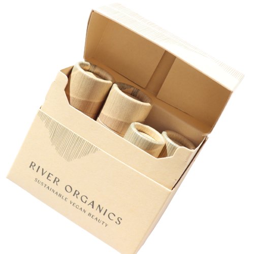 Open cardboard box with beige tubes labeled 'River Organics' on a white background
