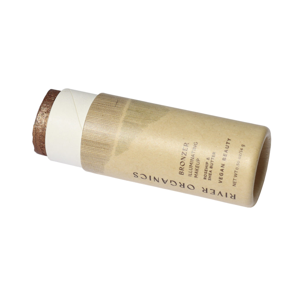 Bamboo bronzer stick with River Organics branding on a white background