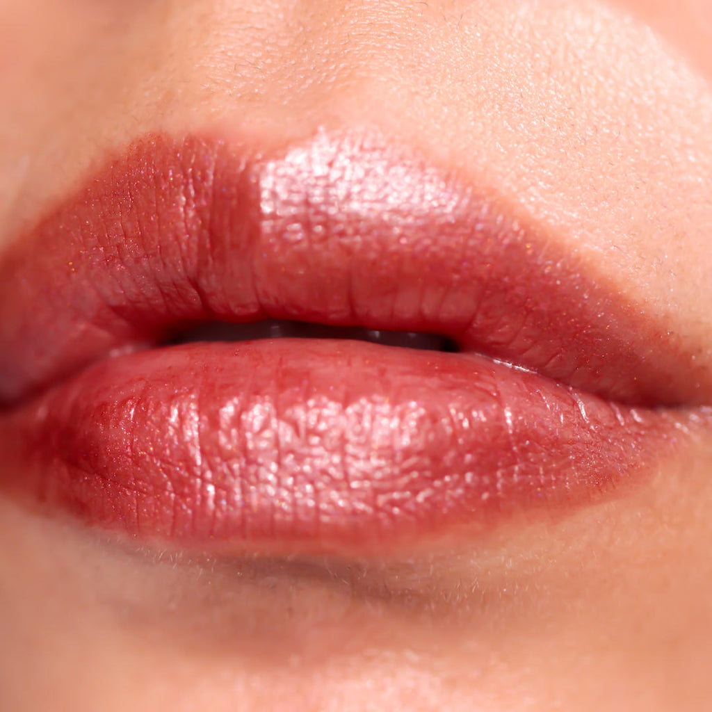 Close-up of a person's lips with a glossy lip color