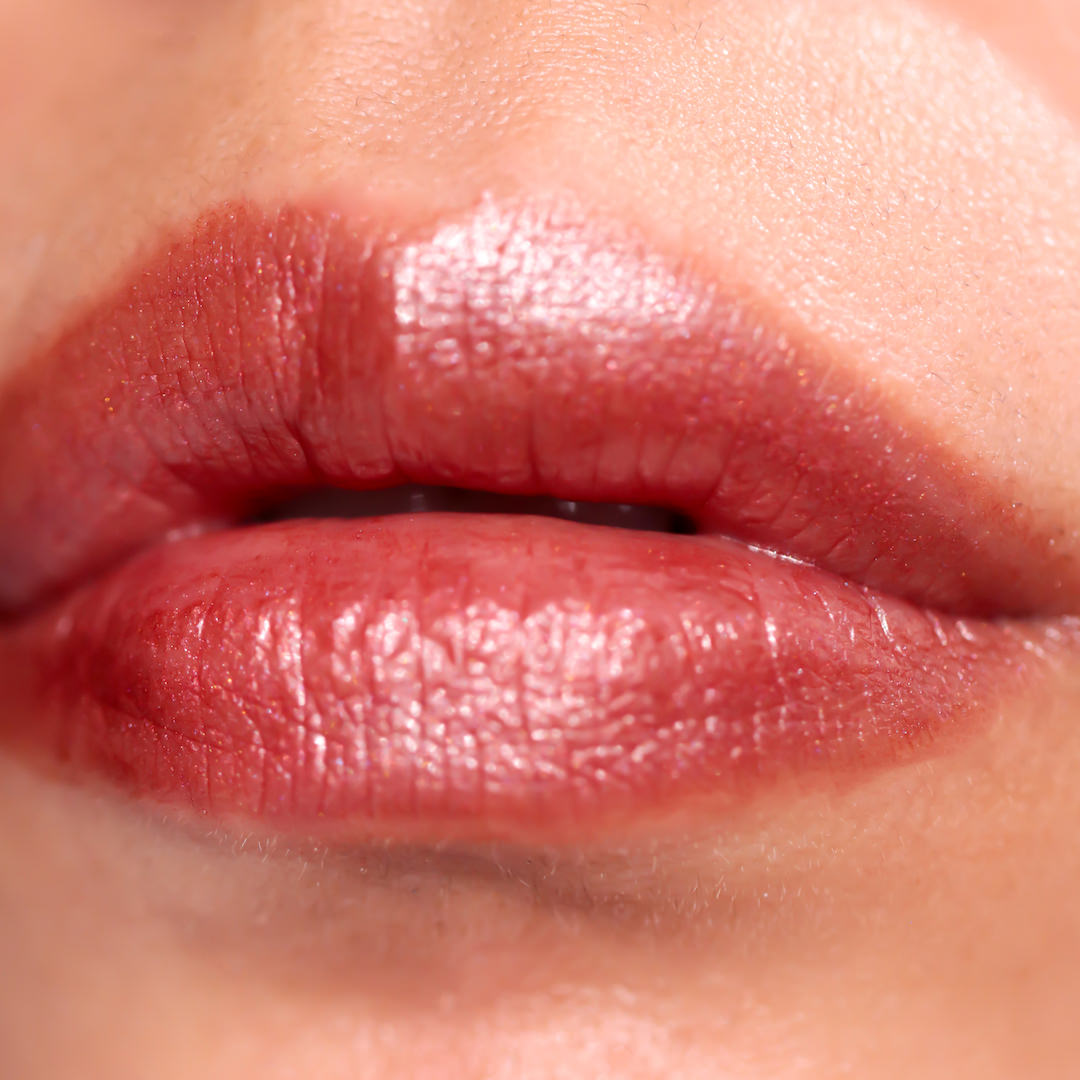 Close-up of a person's lips with a glossy lip color