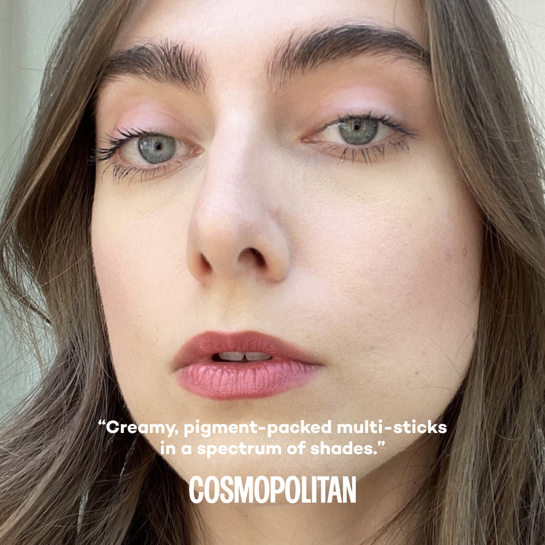 Close-up of a woman's face wearing makeup with text by Cosmopolitan about product 