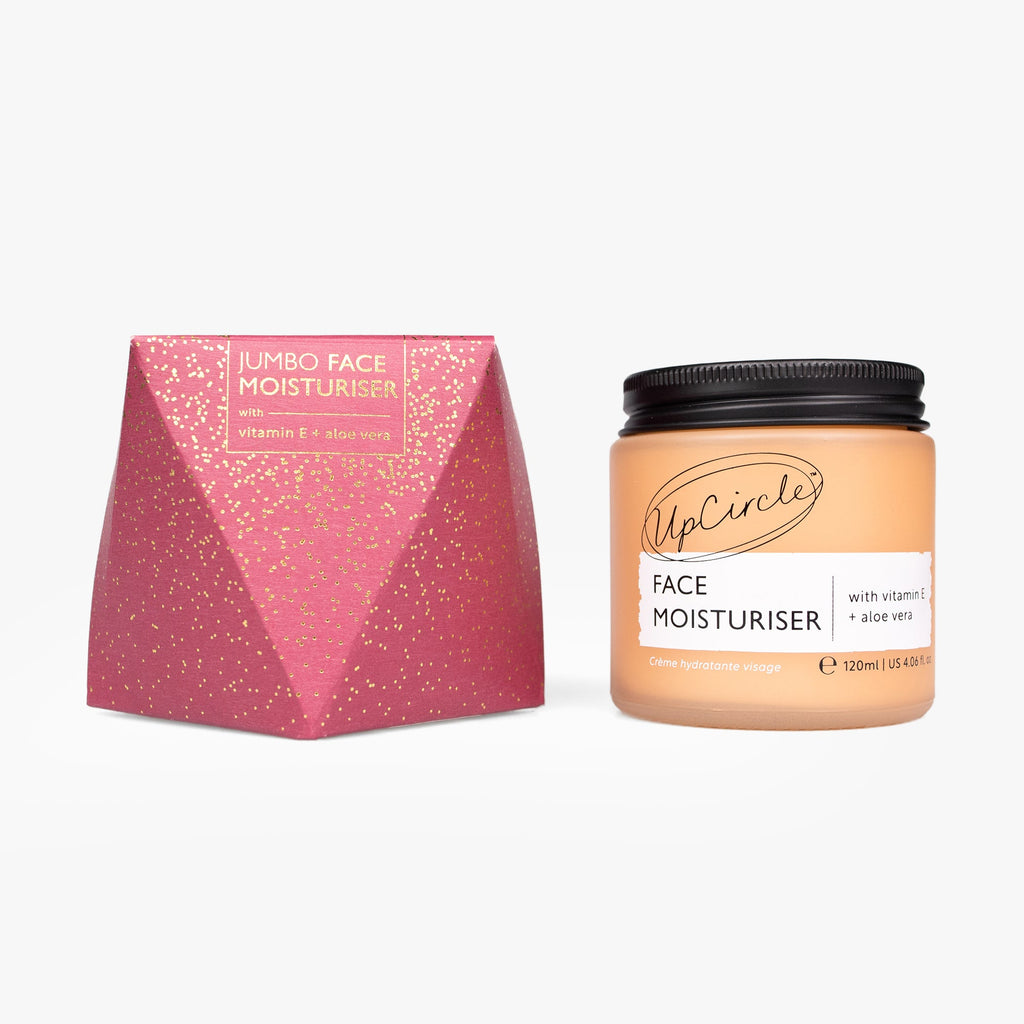 UpCircle face moisturizer jar with pink packaging on a white background