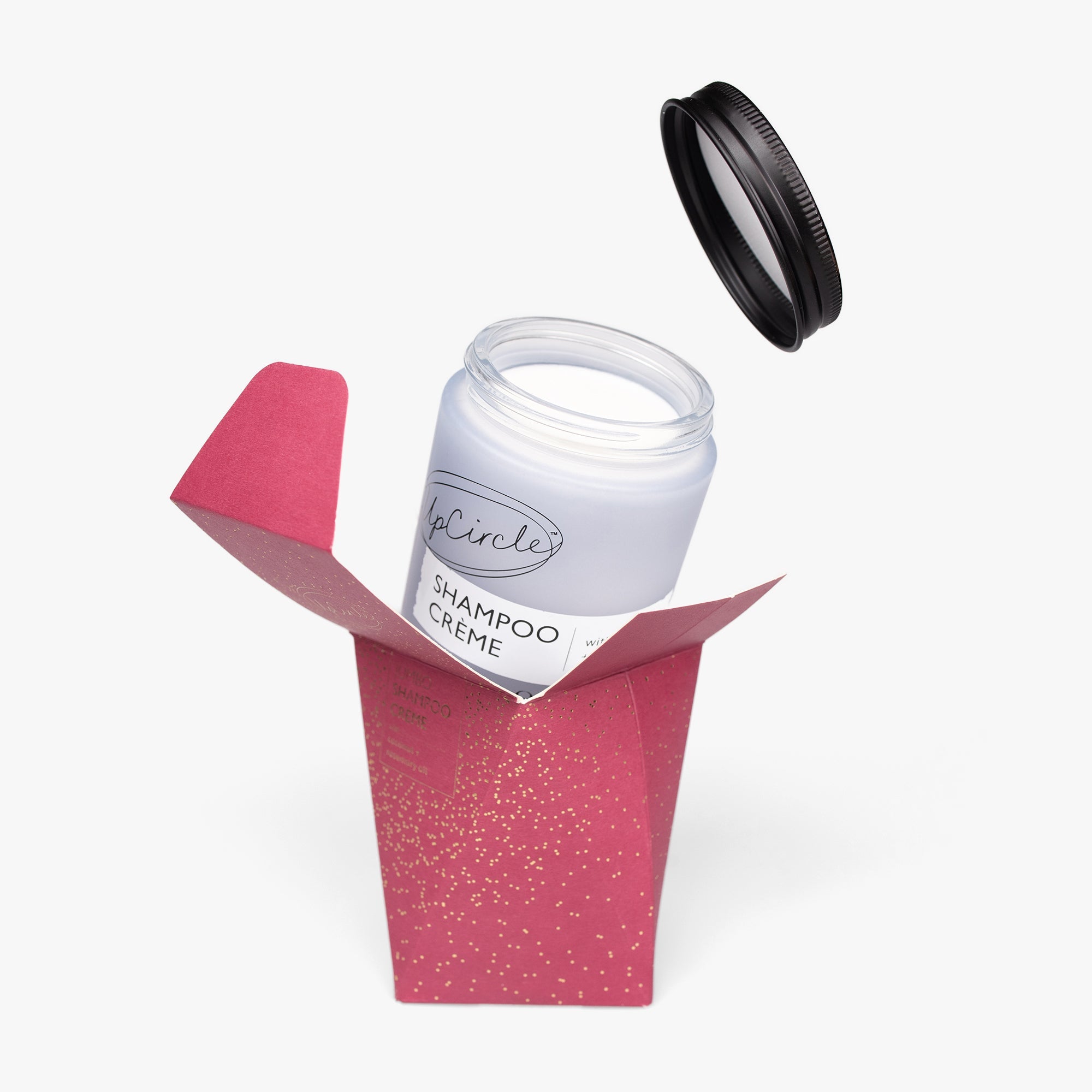 Jar of Shampoo Creme with pink packaging on a white background