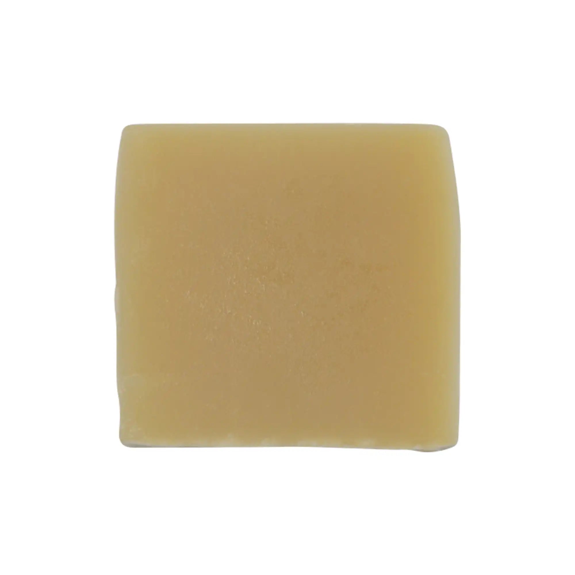 Yellow soap bar on a white background