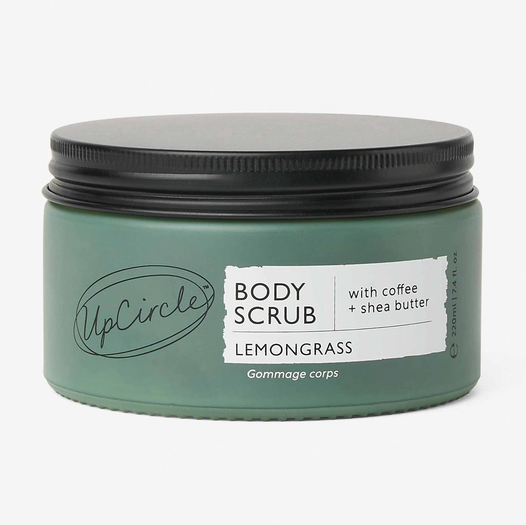 Green jar of UpCircle body scrub with lemongrass scent on a white background