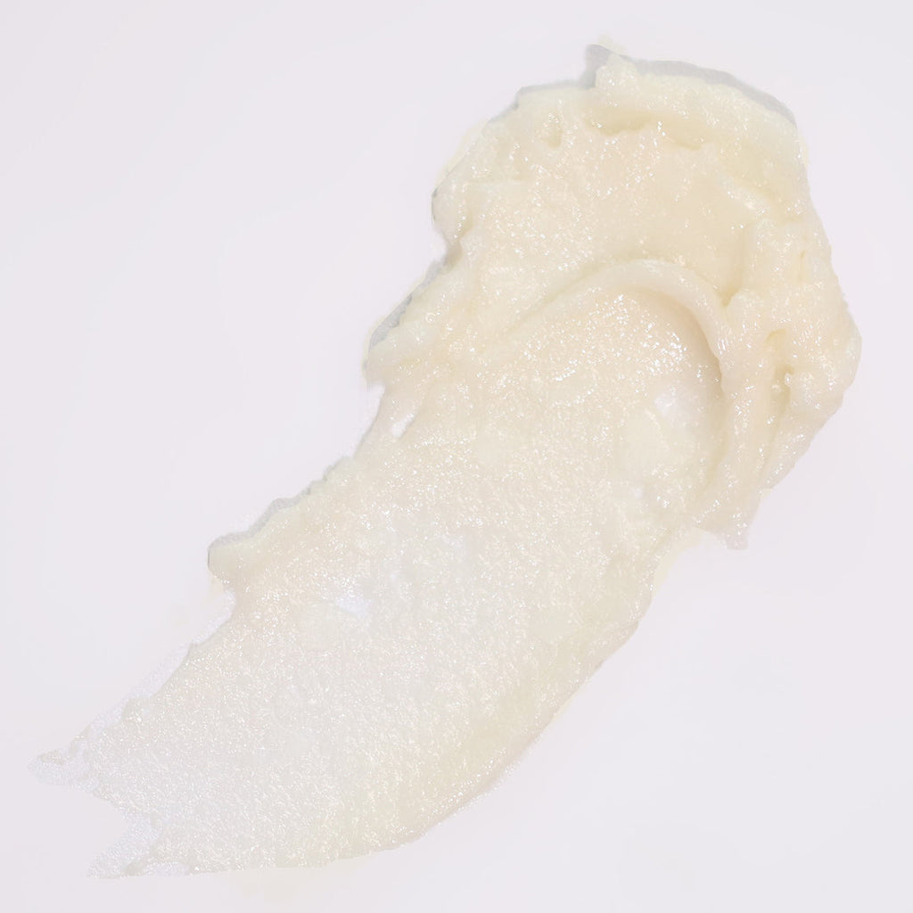 White textured lip balm swatch on a white background