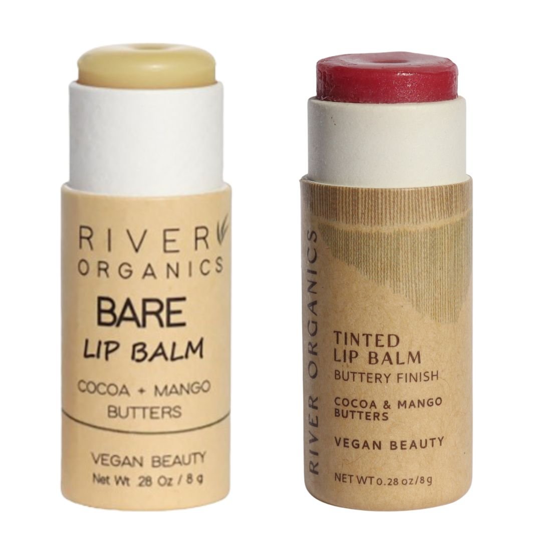 Two River Organics lip balm sticks, one bare and one tinted, on a white background.