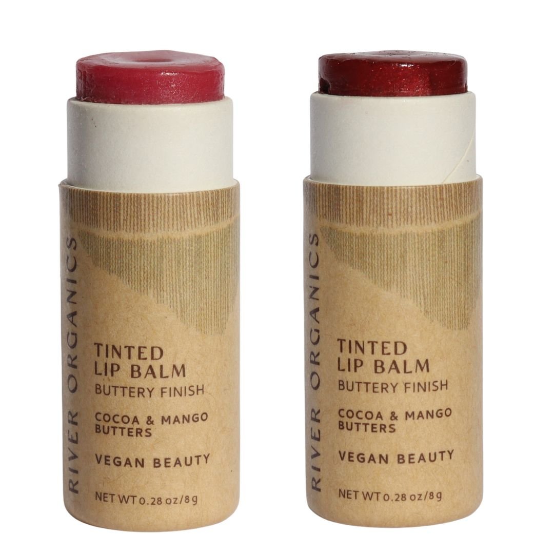 Two River Organics tinted lip balms with brown paper tubes on a white background