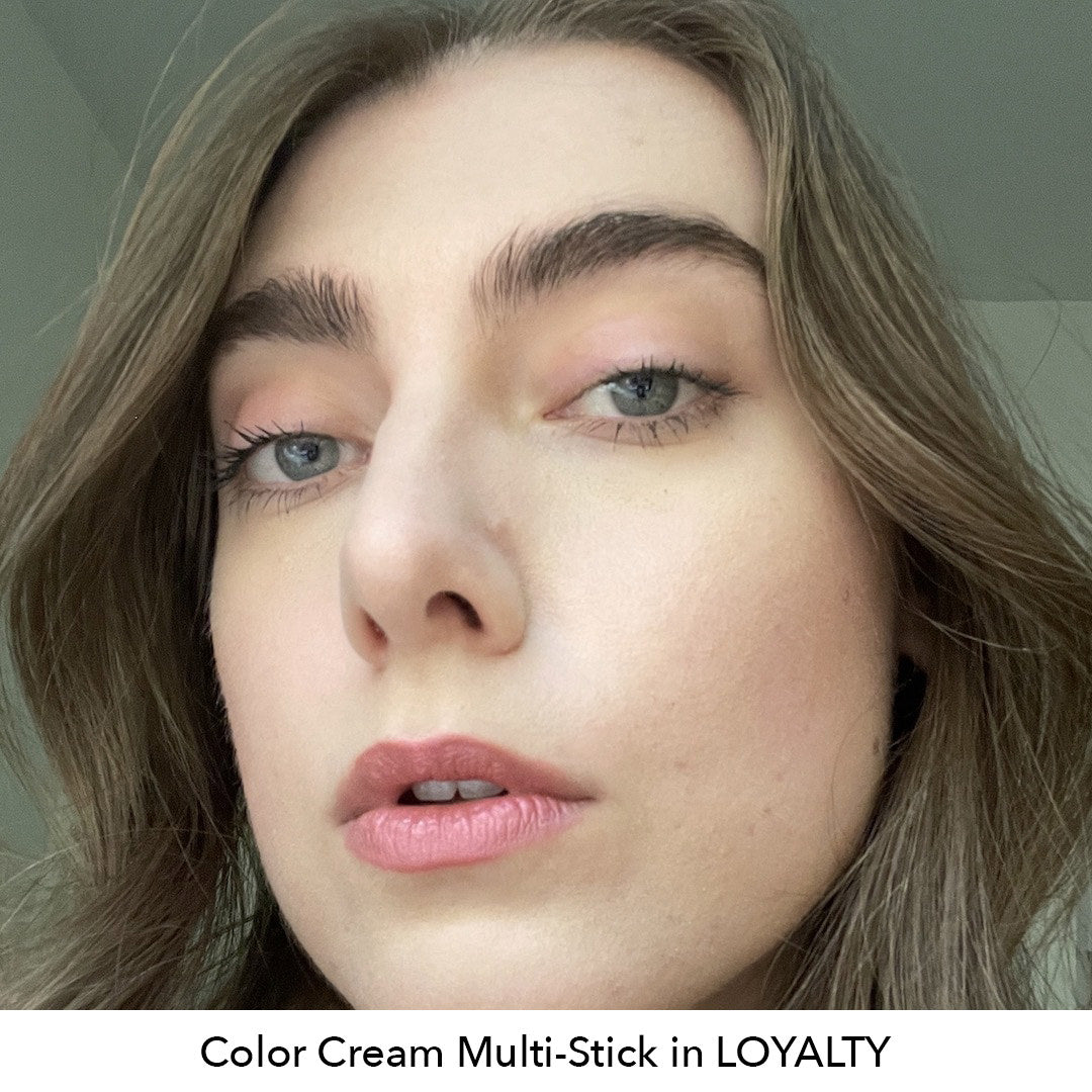 Close-up of a person with text 'Color Cream Multi-Stick in LOYALTY' at the bottom.