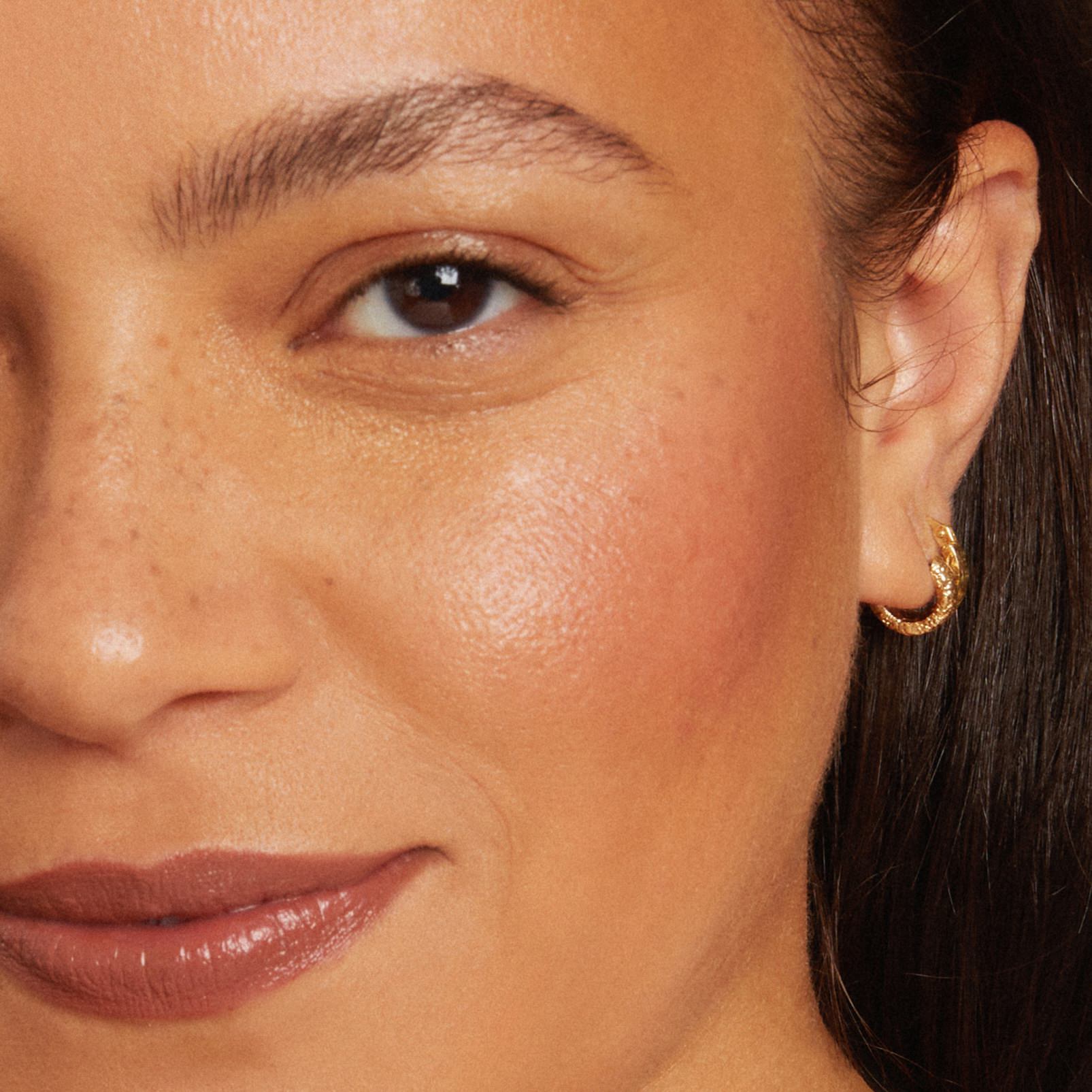 Close-up of a woman's face wearing makeup
