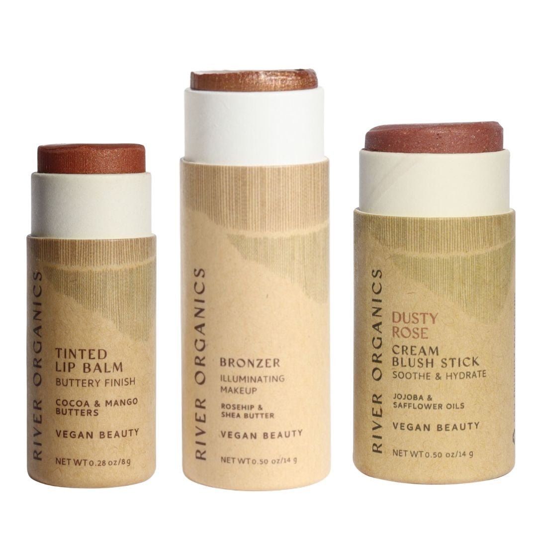 Three River Organics makeup sticks on a white background