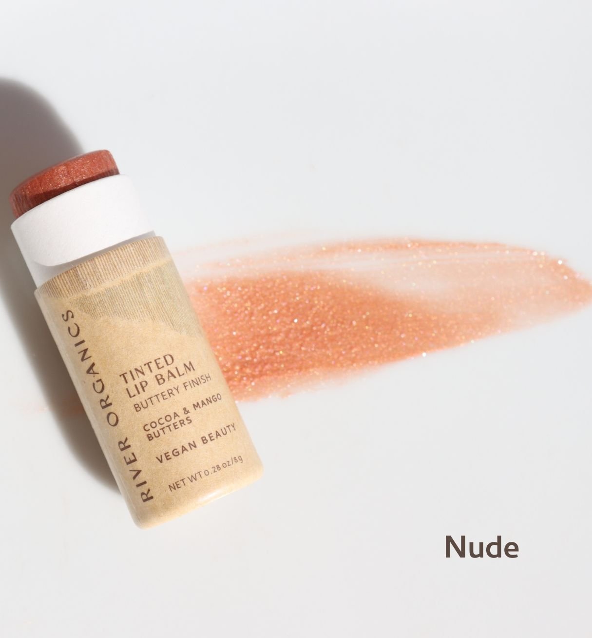 River Organics tinted lip balm with a swatch of color on a light background