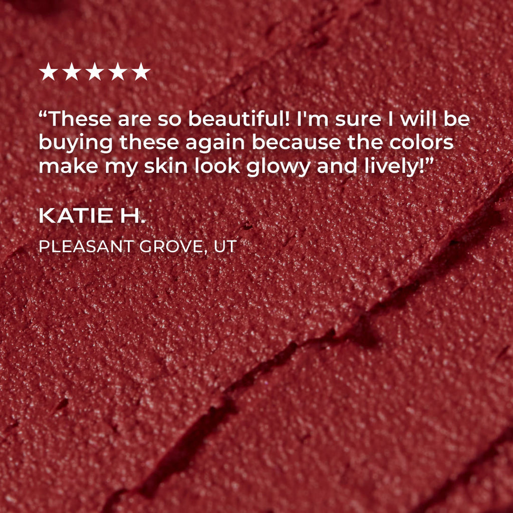 Close-up of a red lipstick with a five-star rating and customer review on a red background