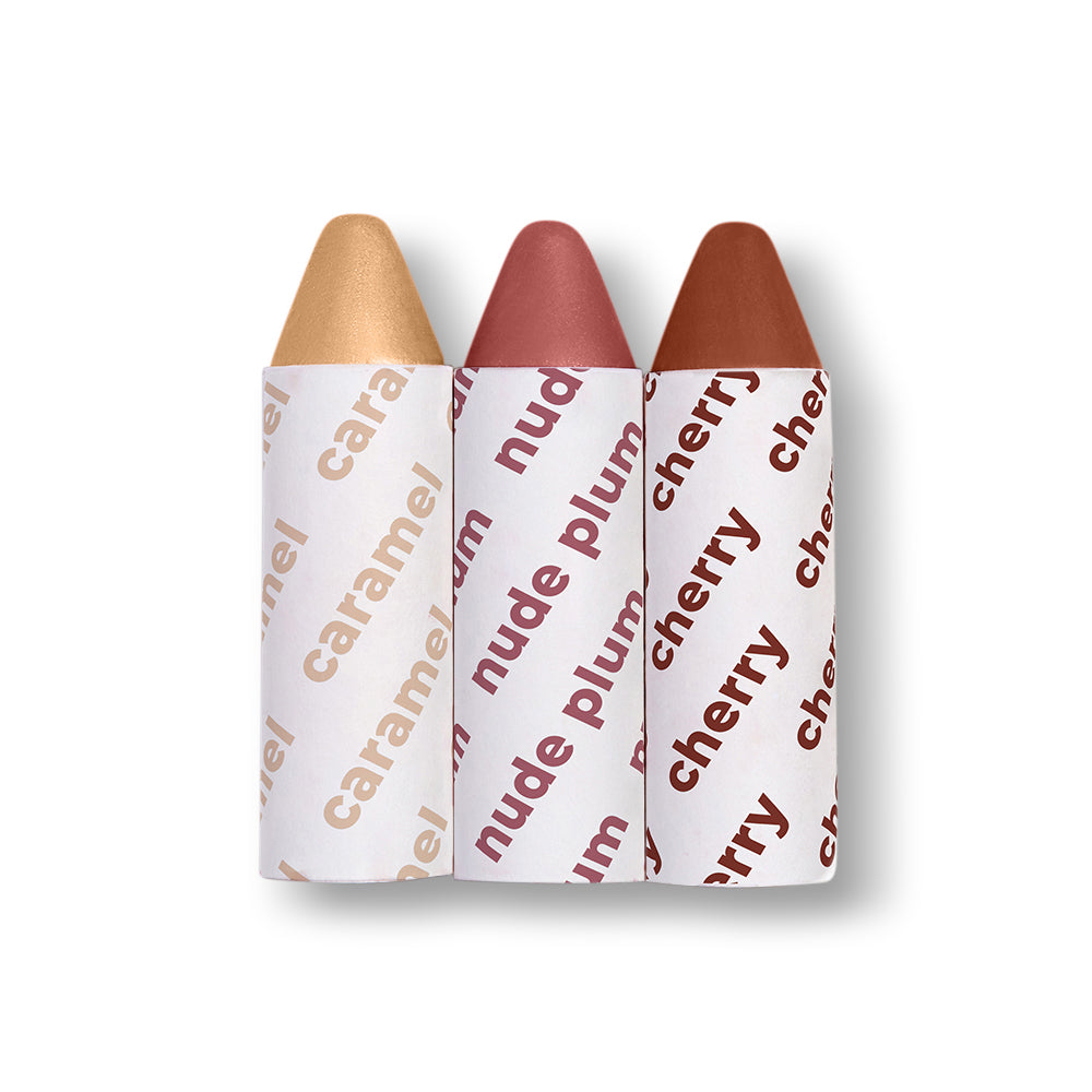 Three lip crayons labeled 'caramel', 'plum', and 'cherry' on a white background
