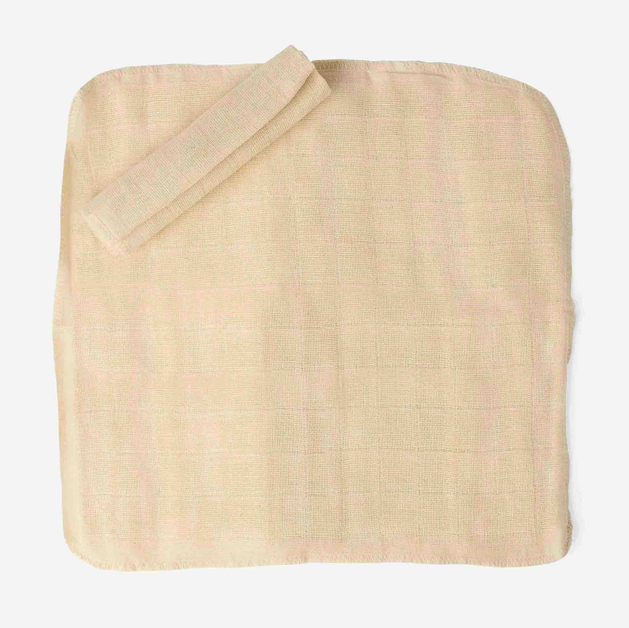 Beige woven washcloth on a white background