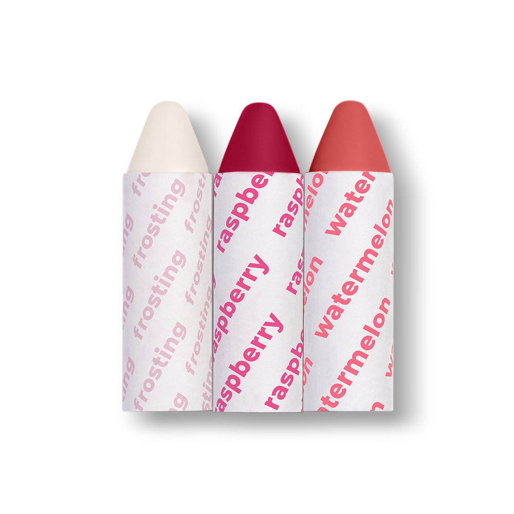 Three lip crayons labeled 'frosting', 'raspberry', and 'watermelon' on a white background