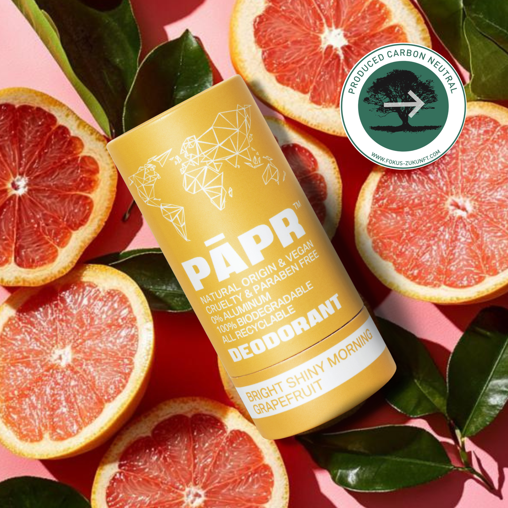 PAPR deodorant tube with grapefruit slices on a pink background