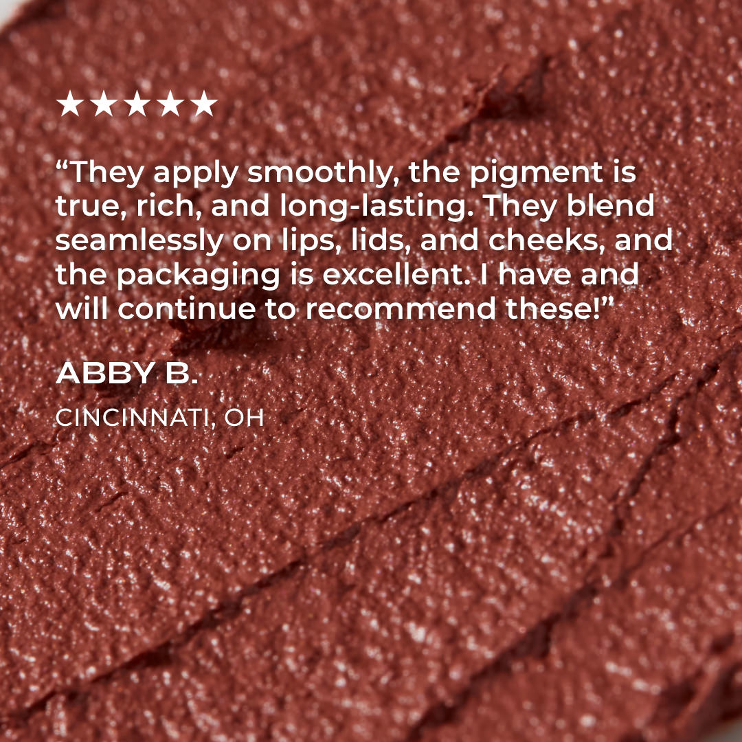 Close-up of brown makeup product with a five-star rating and review text on a brown background.
