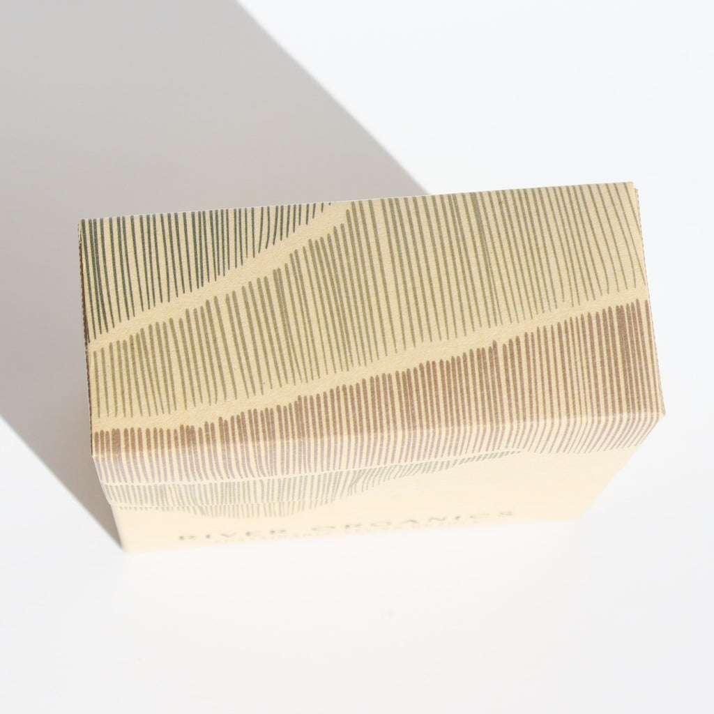 Rectangular box with a striped pattern on a light background