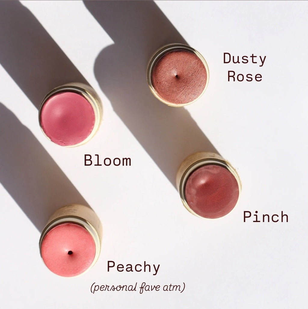 Four blush sticks with labeled colors on a white background