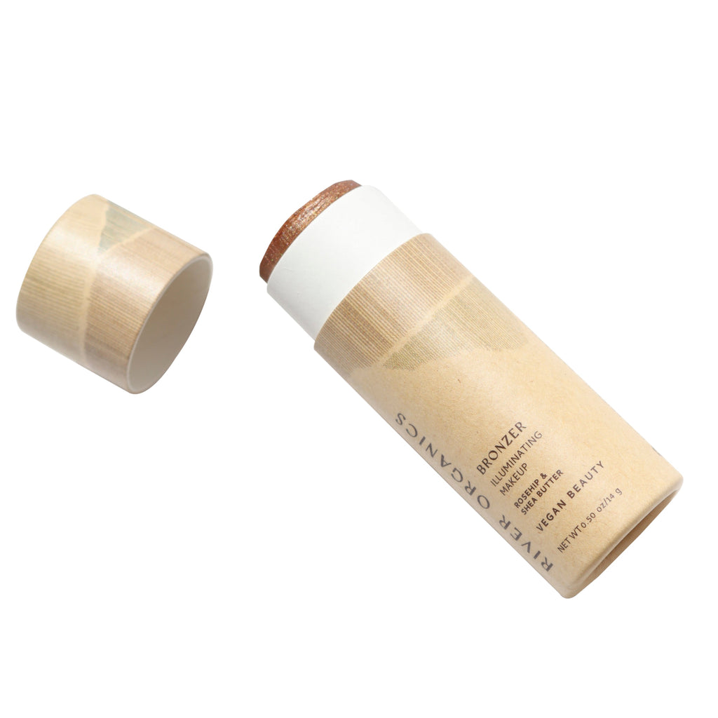 River Organics bronzer stick in a paper tube on a white background