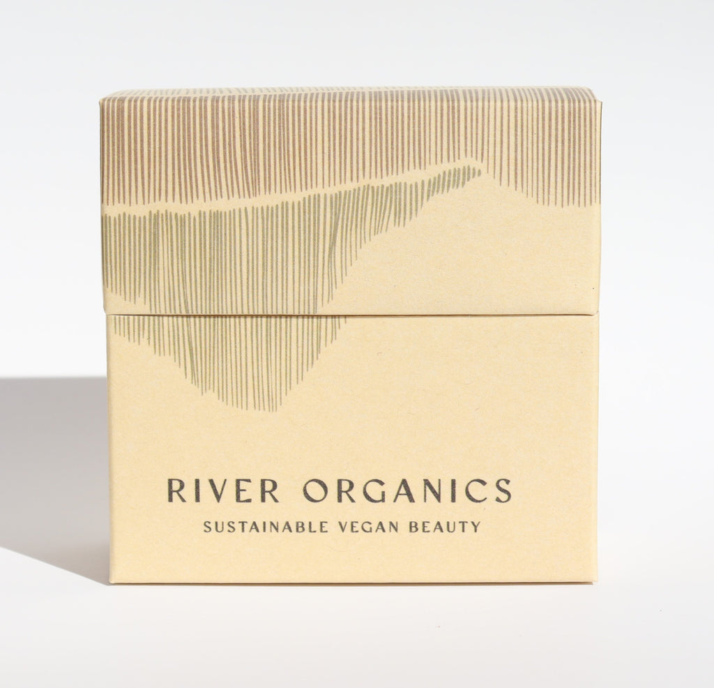 Beige box with 'River Organics' branding on a light gray background
