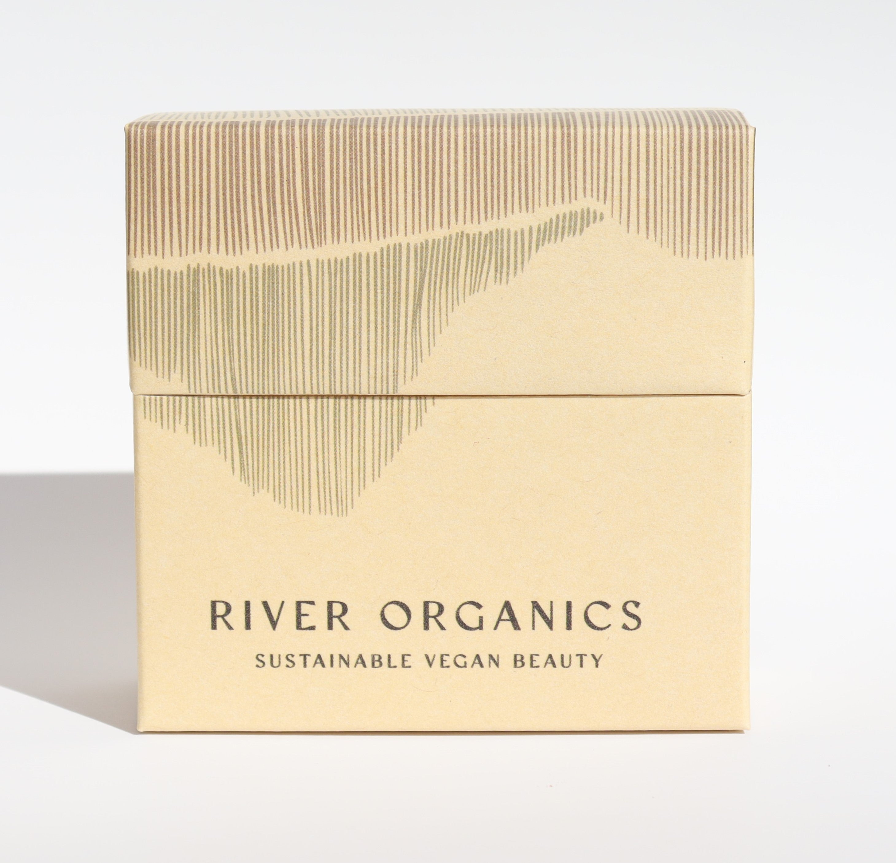 Beige box with 'River Organics' branding on a light gray background