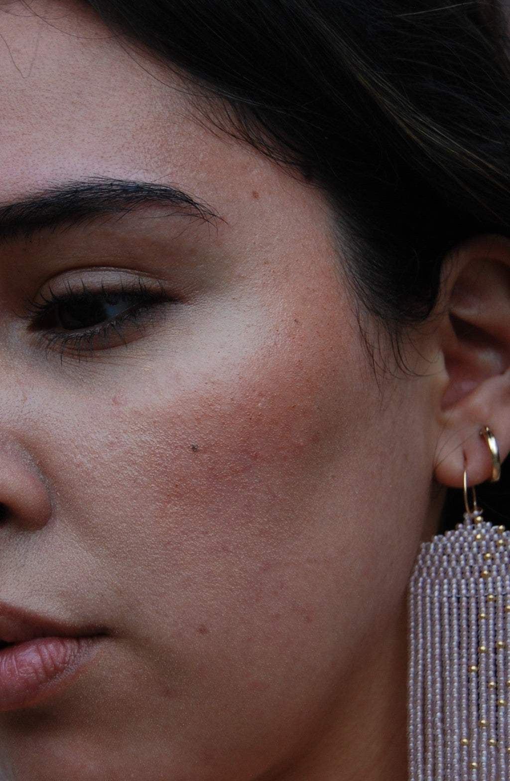 Close-up of a person wearing blush.