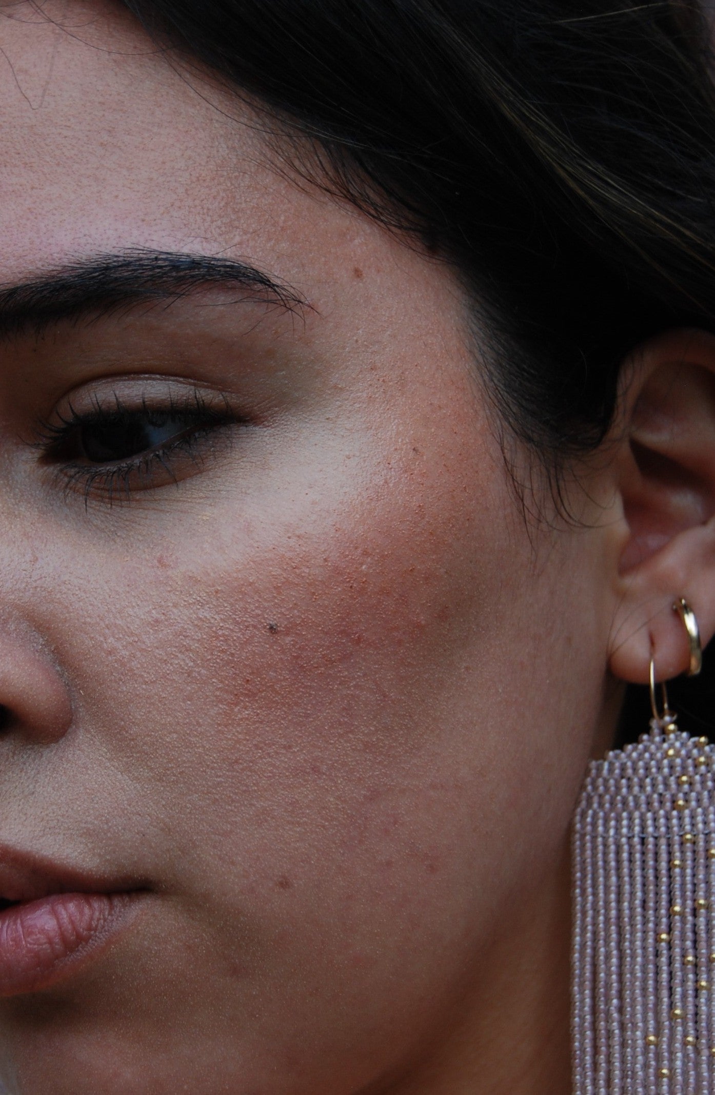 Close-up of a person wearing blush.