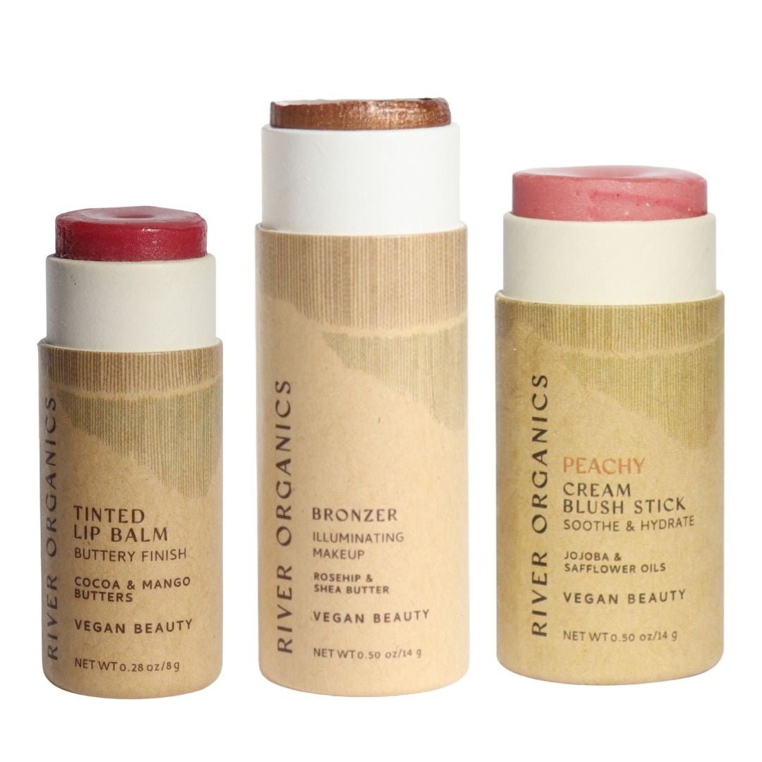 Three River Organics makeup sticks on a white background