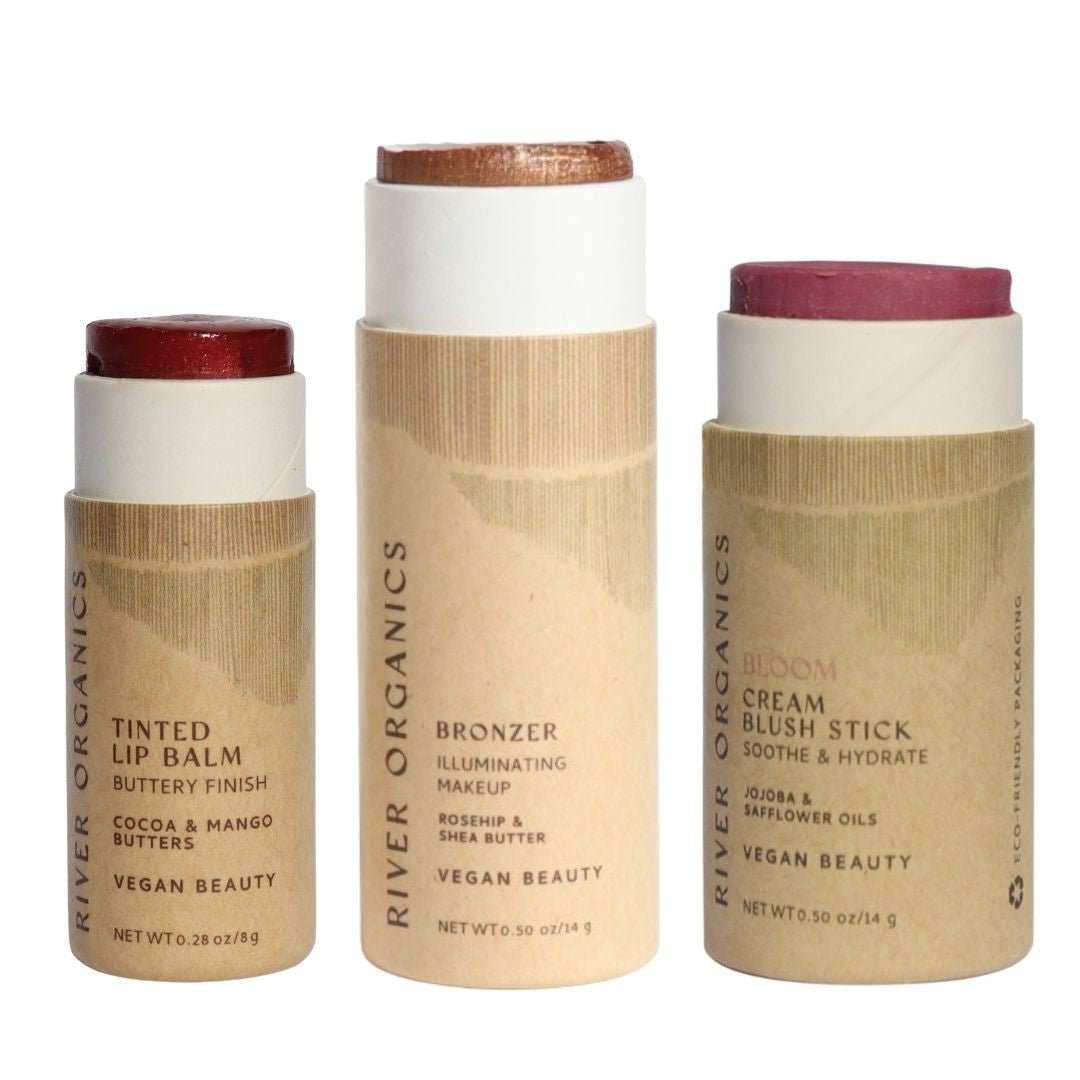 Three River Organics makeup sticks on a white background