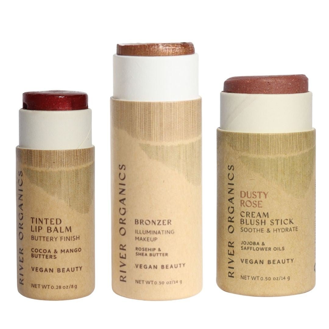 Three River Organics makeup sticks on a white background