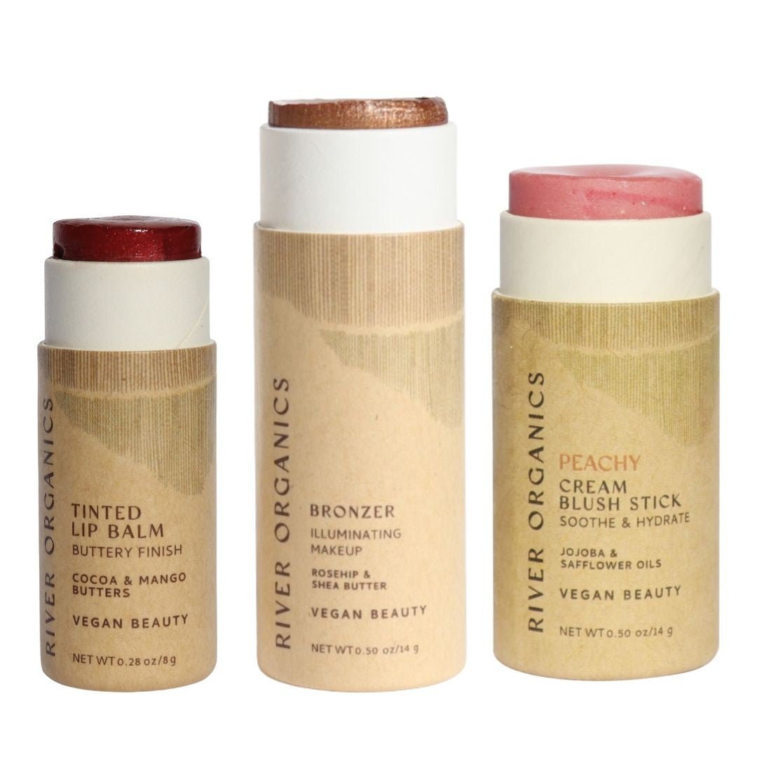 Three River Organics makeup sticks in different colors on a white background