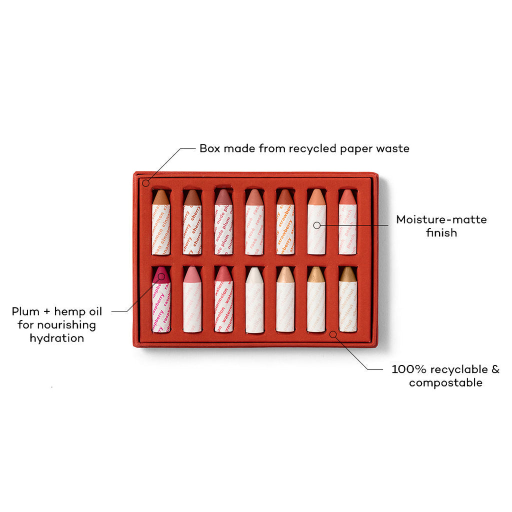 Set of lipsticks in a red box with sustainability features highlighted on a white background