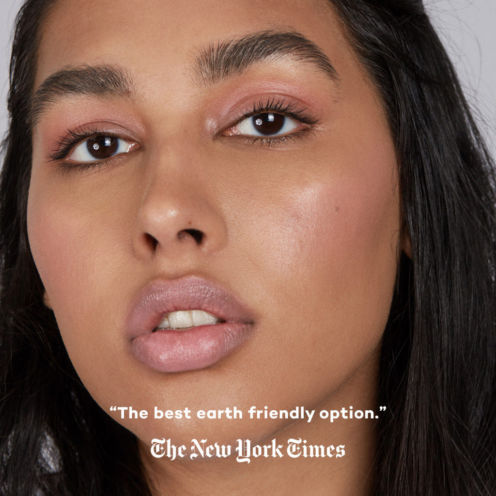 Close-up of a person wearing makeup with text overlay crediting The New York Times