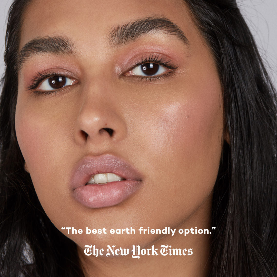 Close-up of a person wearing makeup with text overlay crediting The New York Times