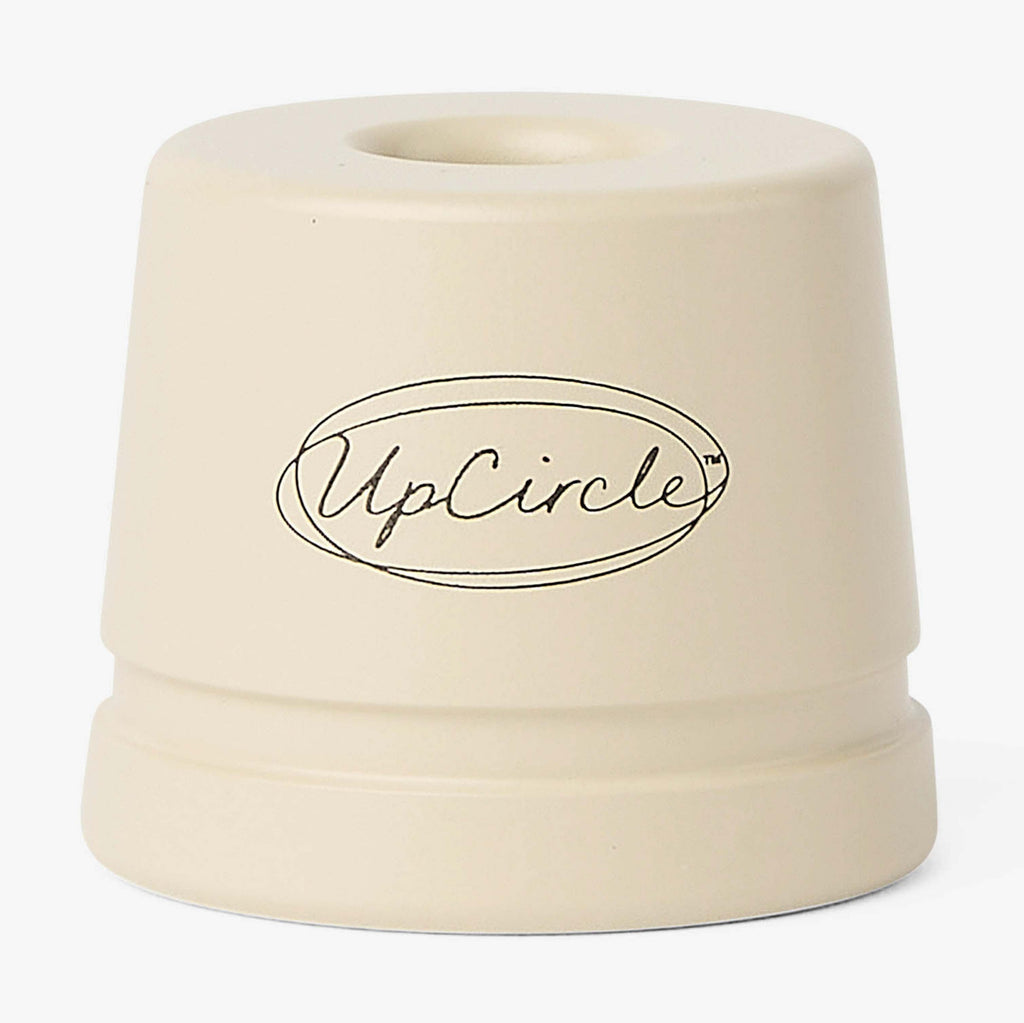 Beige cylindrical product with 'UpCircle' logo on a white background