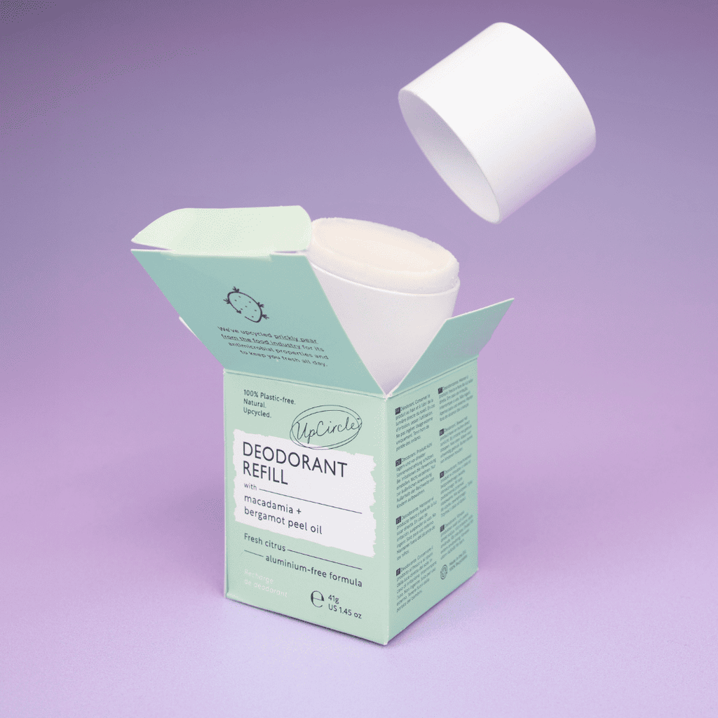 Deodorant refill with packaging on a purple background