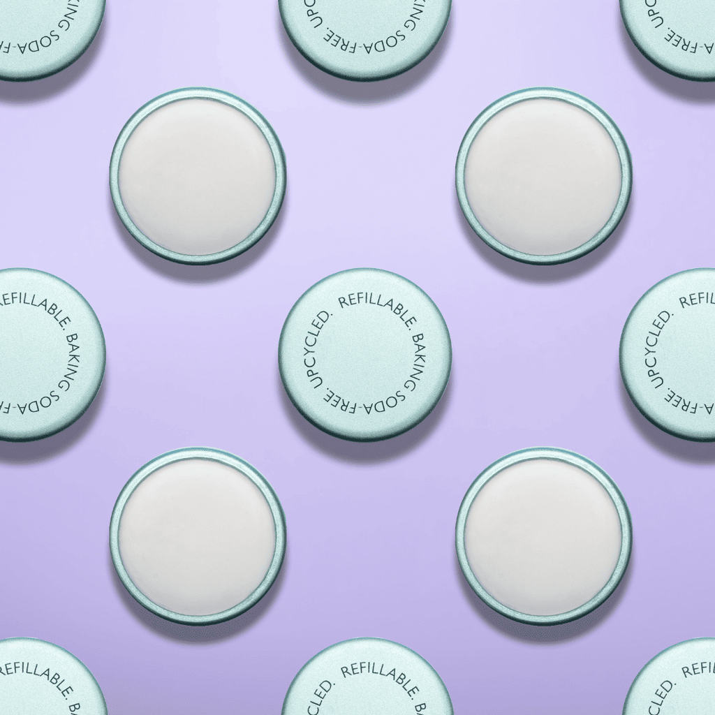 Pattern of green and white circular product containers on a purple background