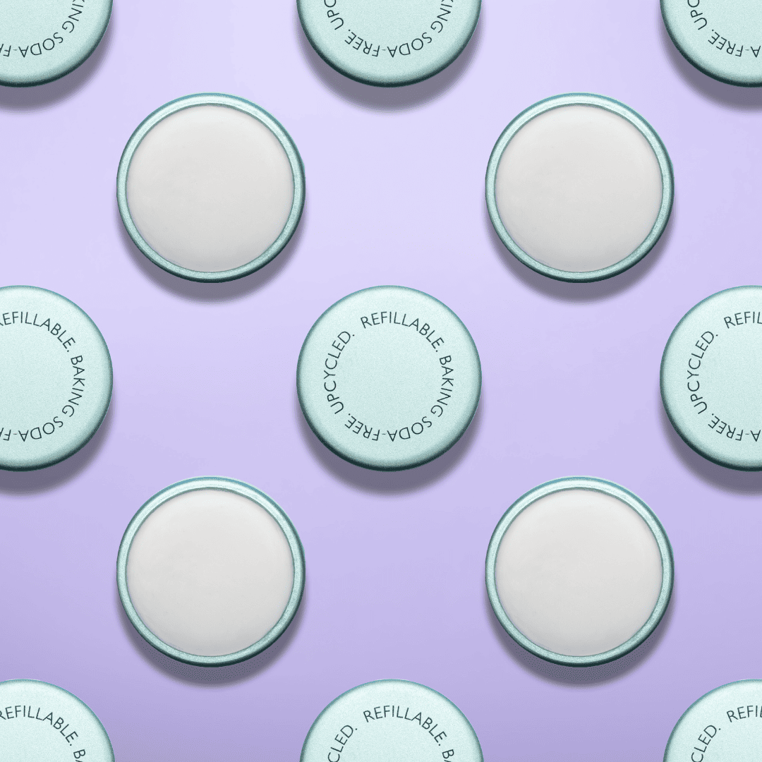 Pattern of green and white circular product containers on a purple background