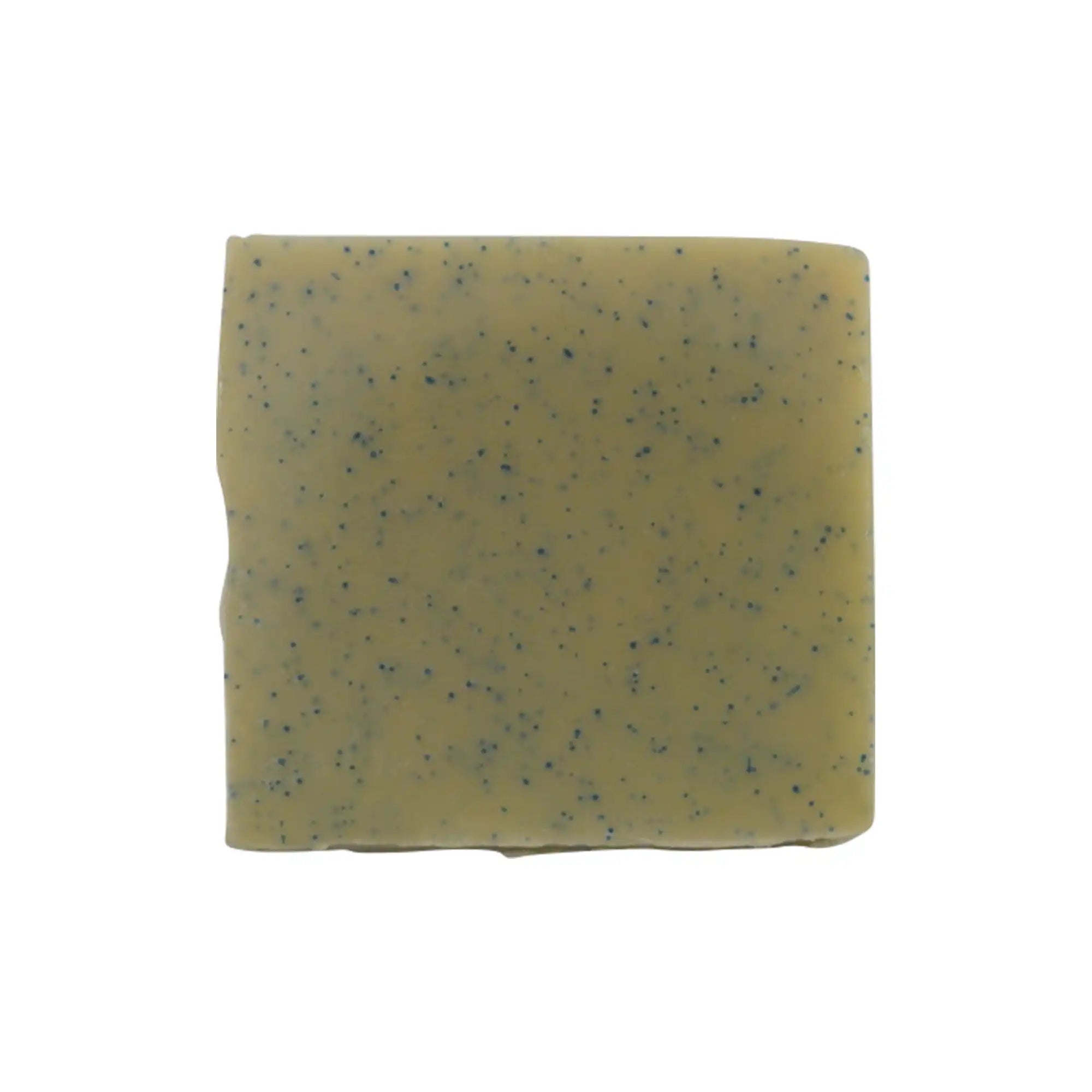 Light green soap bar with blue specks on a white background