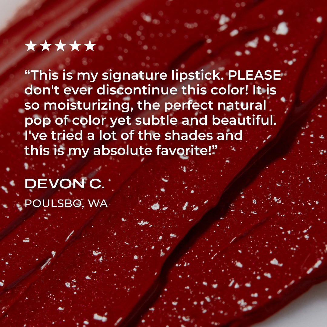 Red lipstick with customer review text on a red background