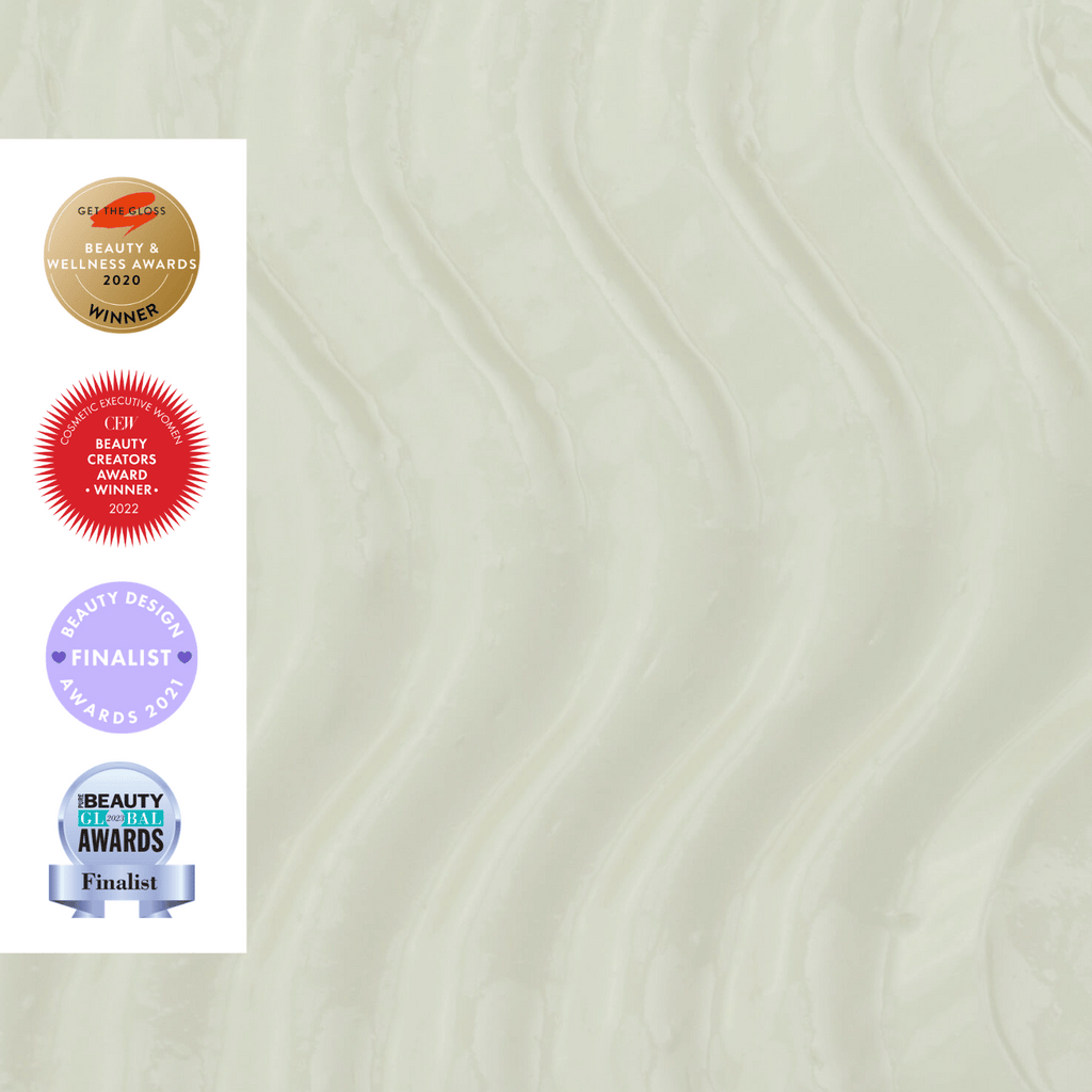 Closeup of body cream texture with Certified Wellness Award, ECF Beauty Award, Beauty Design Awards, and Beauty Best Awards