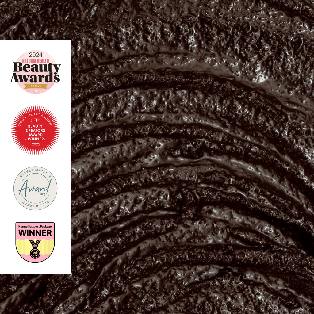 Close-up of coffee face mask texture with 2024 Beauty Awards logos on the left.
