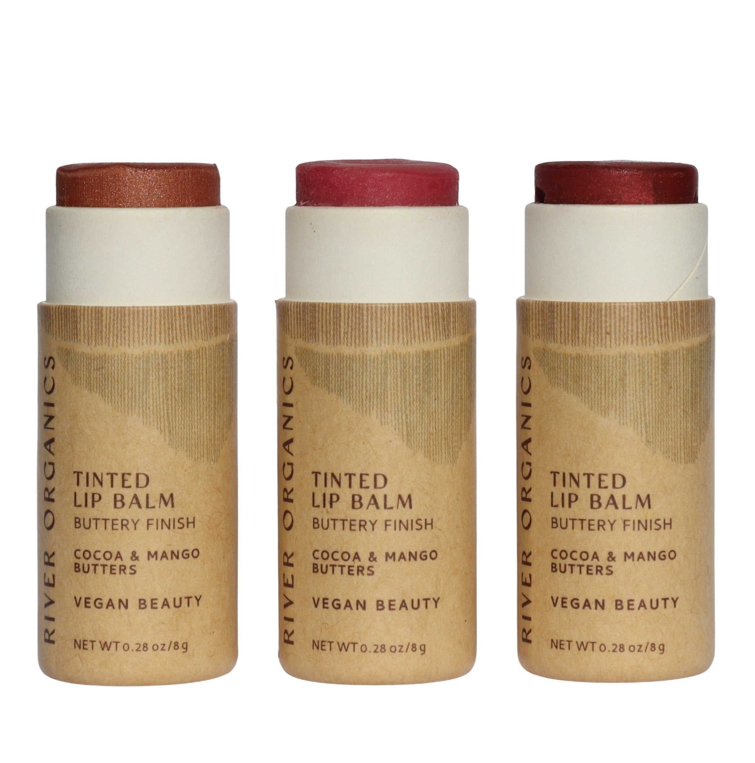 Three River Organics tinted lip balms with brown and white packaging on a white background