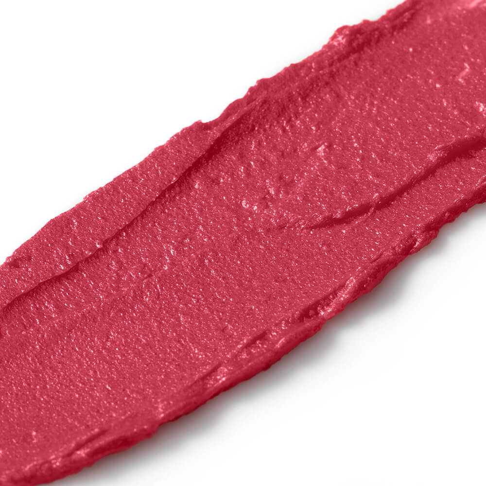 Close-up of a swatch of pink lipstick on a white background