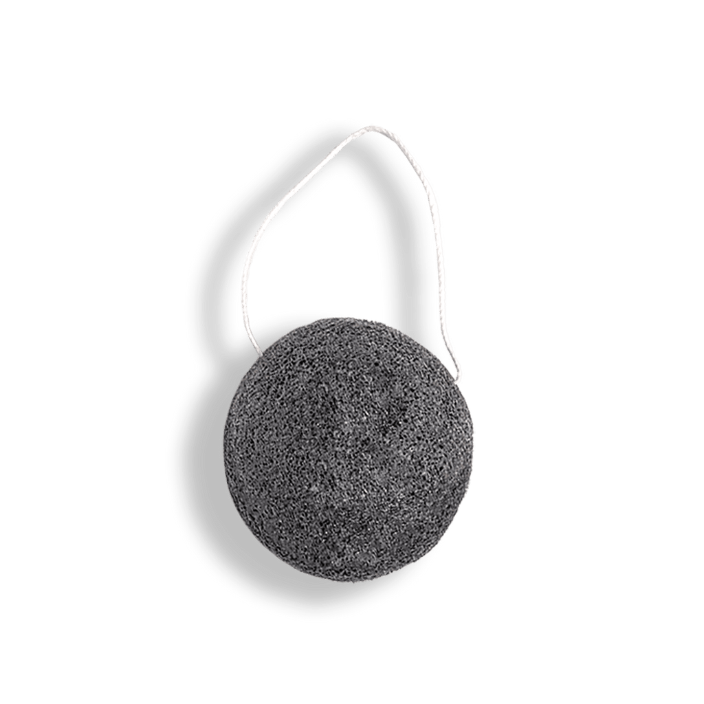 Black konjac sponge with white handle on a transparent background