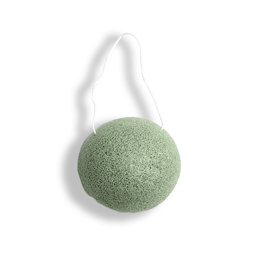 Green konjac sponge with white handle on a transparent background